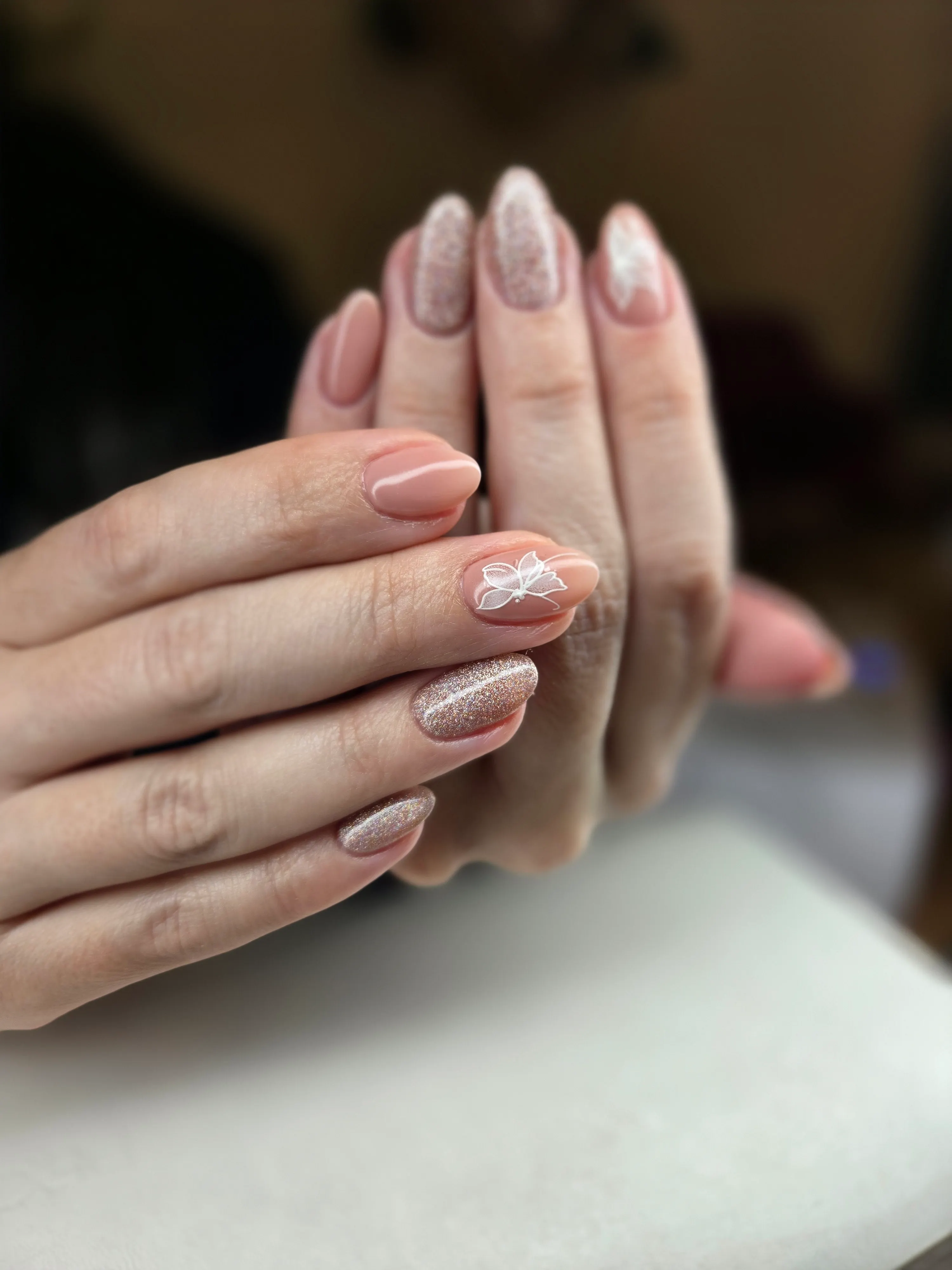 Nude and glitter manicure